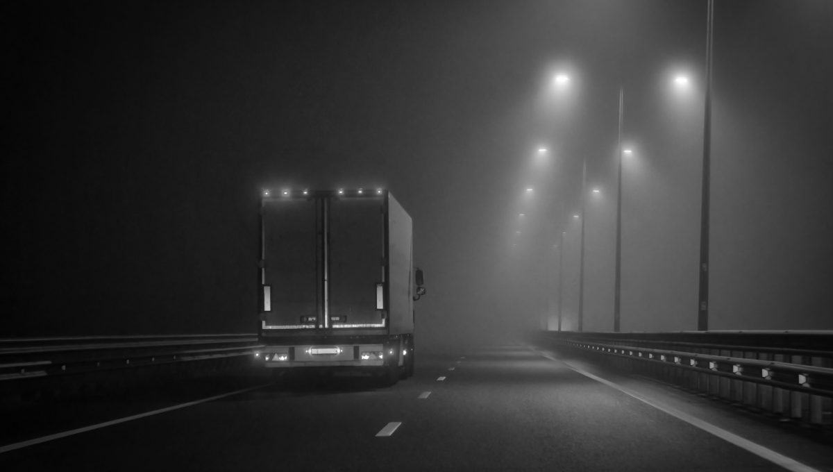 Autonomous truck on road, representing legal uncertainty and compliance issues in AI-driven transport.